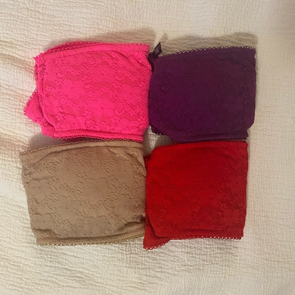 FOUR strapless lace bralettes